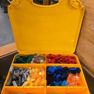 Lego storage suitcase with removable dividers filled with a variety of blocks